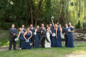 Wedding party posing on the lawn