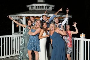 Guests celebrating in front of the illuminated gazebo