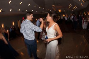 Dancing on the lit indoor dance floor