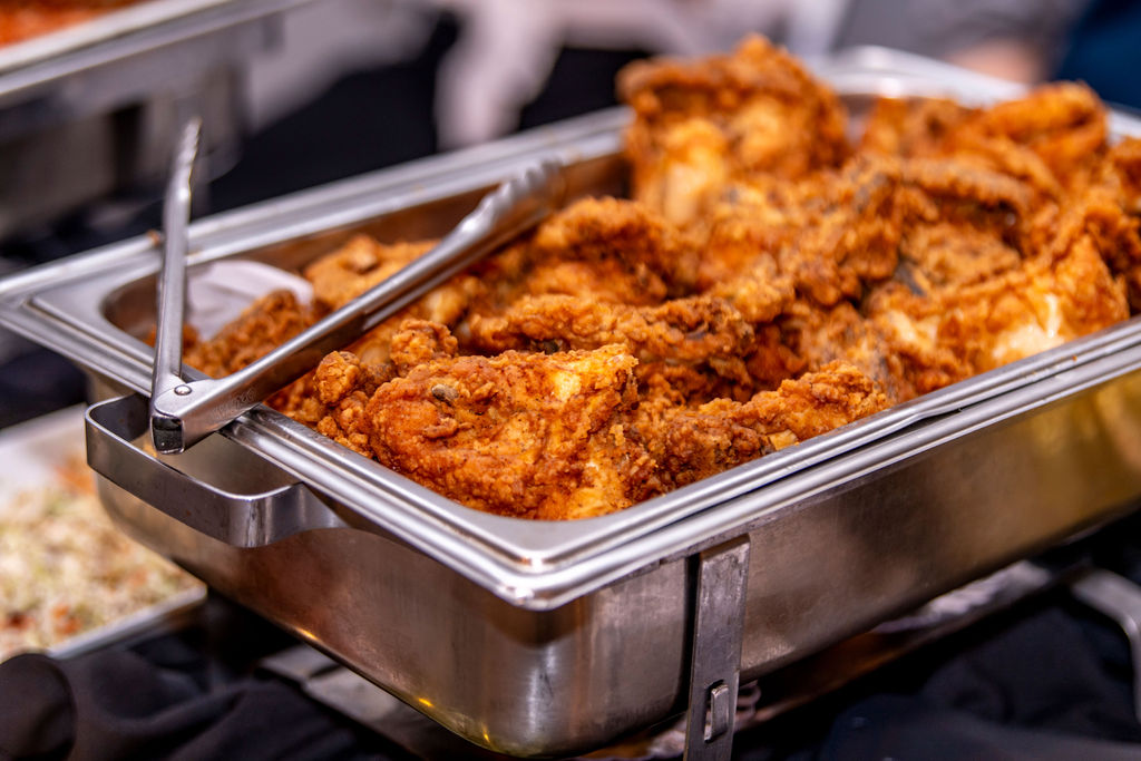 Chafing dish of fried chicken at a catered event